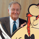 Uderzo posing next to a cutout of Obelix (and techinically Astérix, too short for the frame) in 2015.